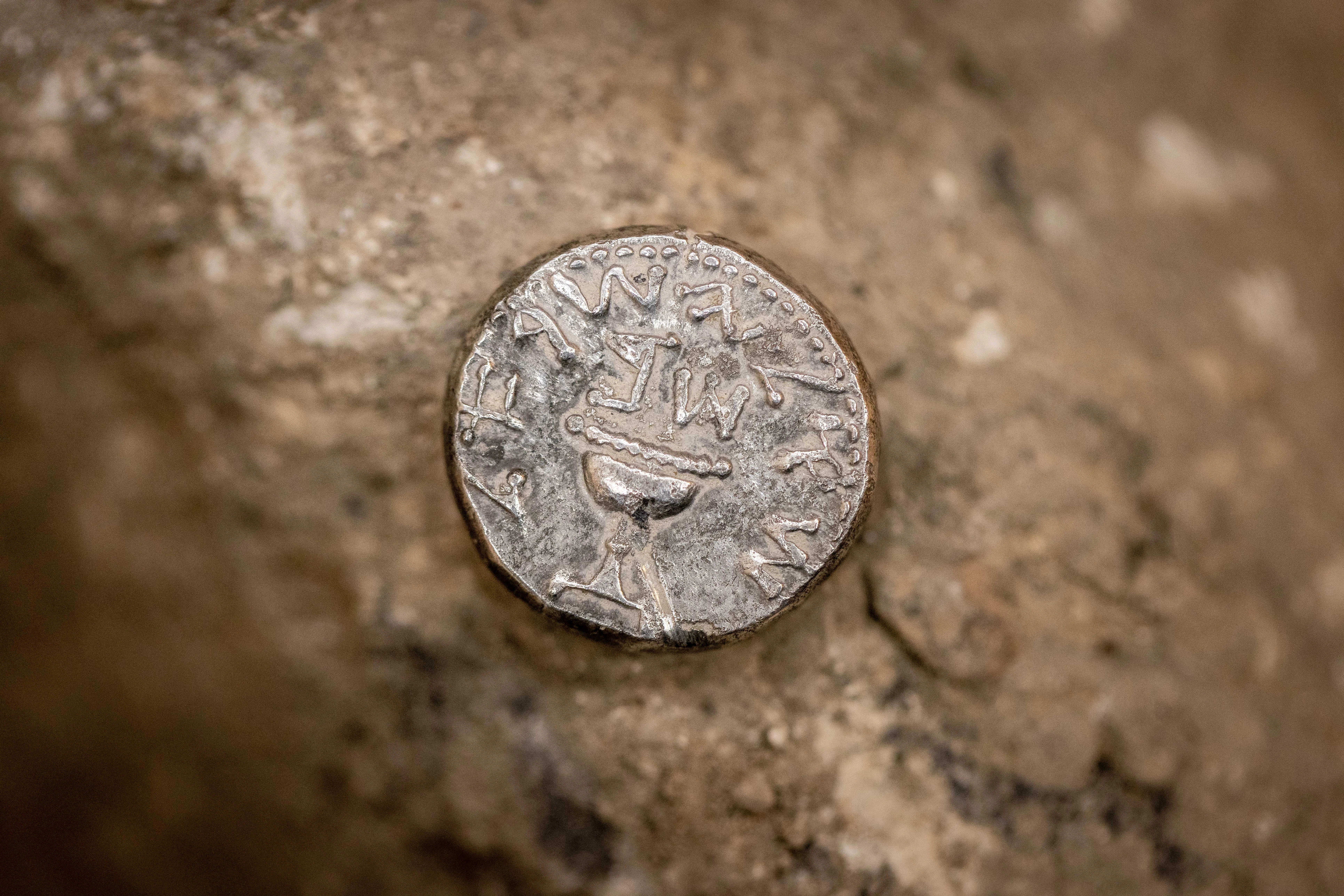 A rare 2,000-year-old silver coin was found by an 11-year-old girl, seen at the Pilgrimage Road at the City of David, in the East Jerusalem neighborhood of Silwan, on November 23, 2021. Photo by Yonatan Sindel/Flash90