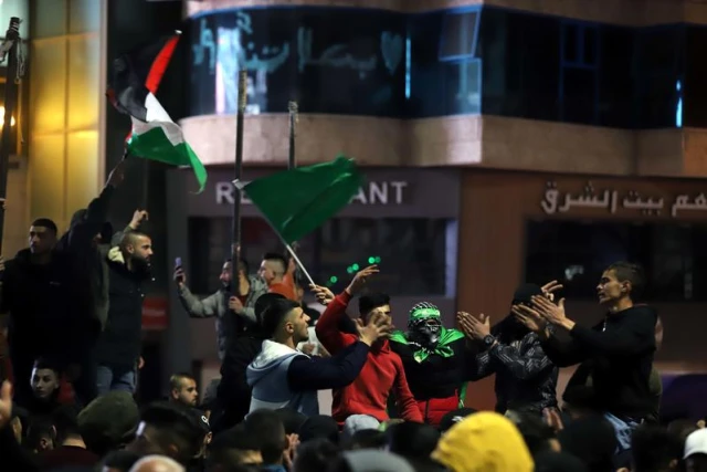 Palestinians celebrate following the deadly terror attack tonight, in the West Bank city of Hebron, January 27, 2023. Photo by Wisam Hashlamoun/Flash90