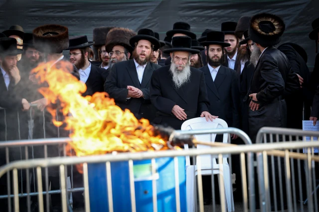 The Rebbe of the Chassidic dynasty of Slonim lights a bonfire during Lag Baomer celebrations, in Meron, on May 9, 2023. Photo by David Cohen/Flash90