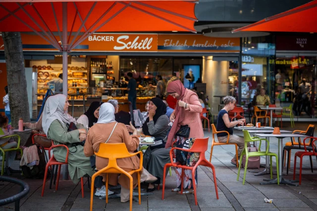Muslim women sit at a fast food restaurant in Stuttgart, Germany. July 20, 2023. Photo by Nati Shohat/FLASH90