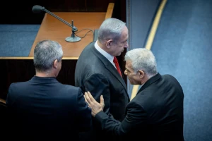 Israeli prime minister Benjamin Netanyahu shake hands with Head of opposition MK Yair Lapid a plenum session for Israeli Knesset's 75th birthday, in the assembly hall of the Knesset, the Israeli parliament in Jerusalem, on January 24, 2024. Photo by Yonatan Sindel/Flash90