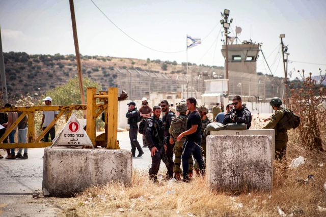 Israeli soldiers guard during a protest of Jewish settlers outside the West Bank city of Nablus, in response to the car ramming attack last night, May 30, 2024. Photo by Nasser Ishtayeh/Flash90