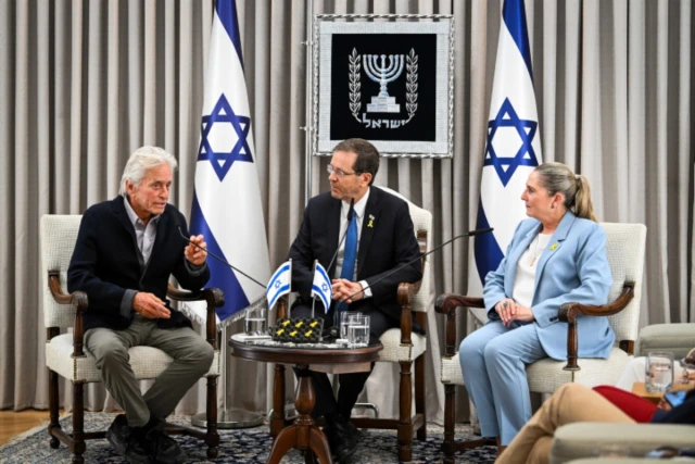 Israeli President Isaac Herzog and his wife Michal meet with American actor Michael Douglas at the President residence in Jerusalem, June 2, 2024 (Photo: Arie Leib Abrams/Flash90).