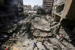 Palestinians amid destruction in Nuseirat camp in the central Gaza Strip, on June 8, 2024. Photo by Khaled Ali/Flash90