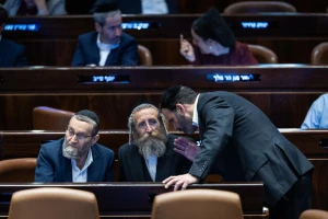 Illustration: MK Moshe Gafni of Degel HaTorah (United Torah Judaism) confers with fellow UTJ members during a Knesset plenum vote on reviving the ultra-Orthodox enlistment bill, Jerusalem, June 11, 2024. (Photo: Yonatan Sindel/Flash90)