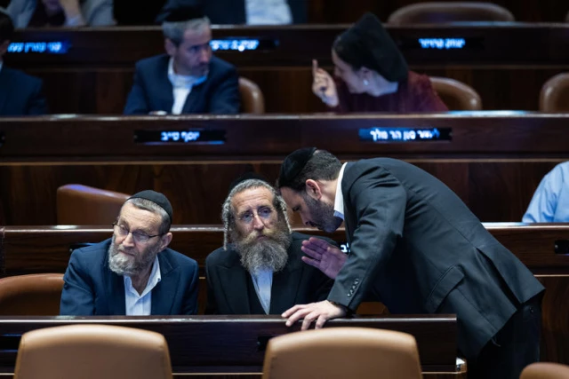 Illustration: MK Moshe Gafni of Degel HaTorah (United Torah Judaism) confers with fellow UTJ members during a Knesset plenum vote on reviving the ultra-Orthodox enlistment bill, Jerusalem, June 11, 2024. (Photo: Yonatan Sindel/Flash90)