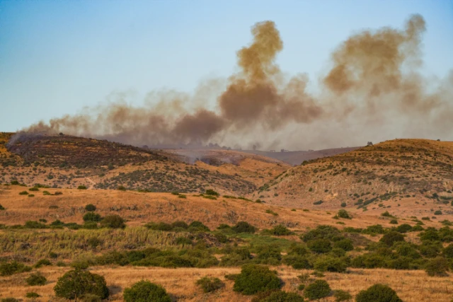 Smoke and fire after rockets fired from Lebanon hit an open area in the Golan Heights, July 3, 2024. (Photo by Ayal Margolin/Flash90)