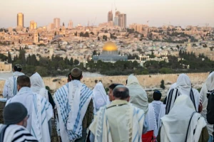 Jewish men cover with prayer shwals during Sukkot at a lookout of the Mount of Olives, overlooking the Old city of Jerusalem on October 23, 2024. Photo by Yonatan Sindel/Flash90