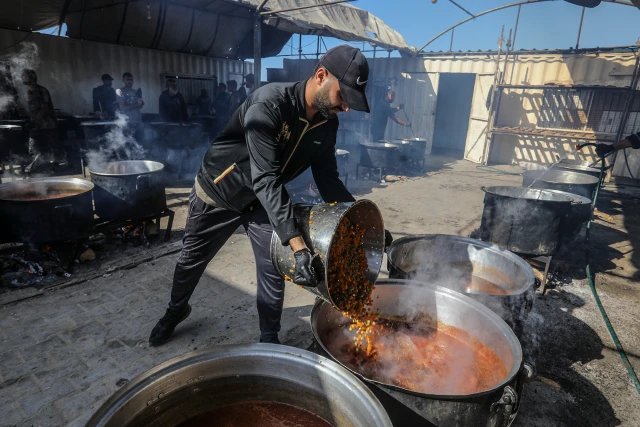 Displaced Palestinians receive food from the World Food Program and UNRWA in Khan Yunis, in the Southern Gaza Strip, on November 16, 2024. Photo by Abed Rahim Khatib/Flash90