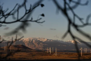 A station of wind turbines with snowy Mount Hermon in the background in the Golan Heights, November 26, 2024. Photo by Michael Giladi/ Flash90