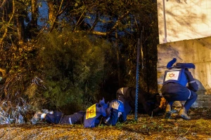 People take cover as siren warns of incoming missile fired from Yemen, near Rehovot, December 30, 2024. Photo by Yossi Aloni/Flash90