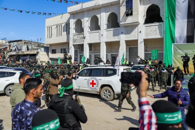 Hamas terrorists hand over four Israeli hostages to the Red Cross in Palestine Square, Gaza City, on Jan. 25, 2025. Photo by Khalil Kahlout/Flash90