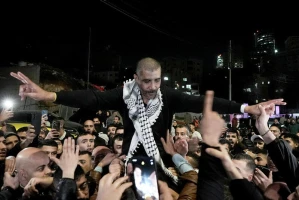 A crowd greets Zakaria Zubeidi who were released in a hostage deal between Israel and Hamas as he arrives to the West Bank city of Ramallah, January 30, 2025. Photo by Flash90