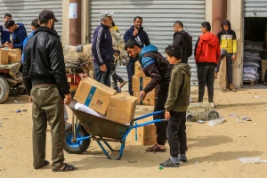 Palestinians receive food aid from the World Food Program (WFP) in cooperation with the United Nations Relief and Works Agency (UNRWA) in Khan Yunis, in the southern Gaza Strip, February 19, 2025. Photo by Abed Rahim Khatib/Flash90