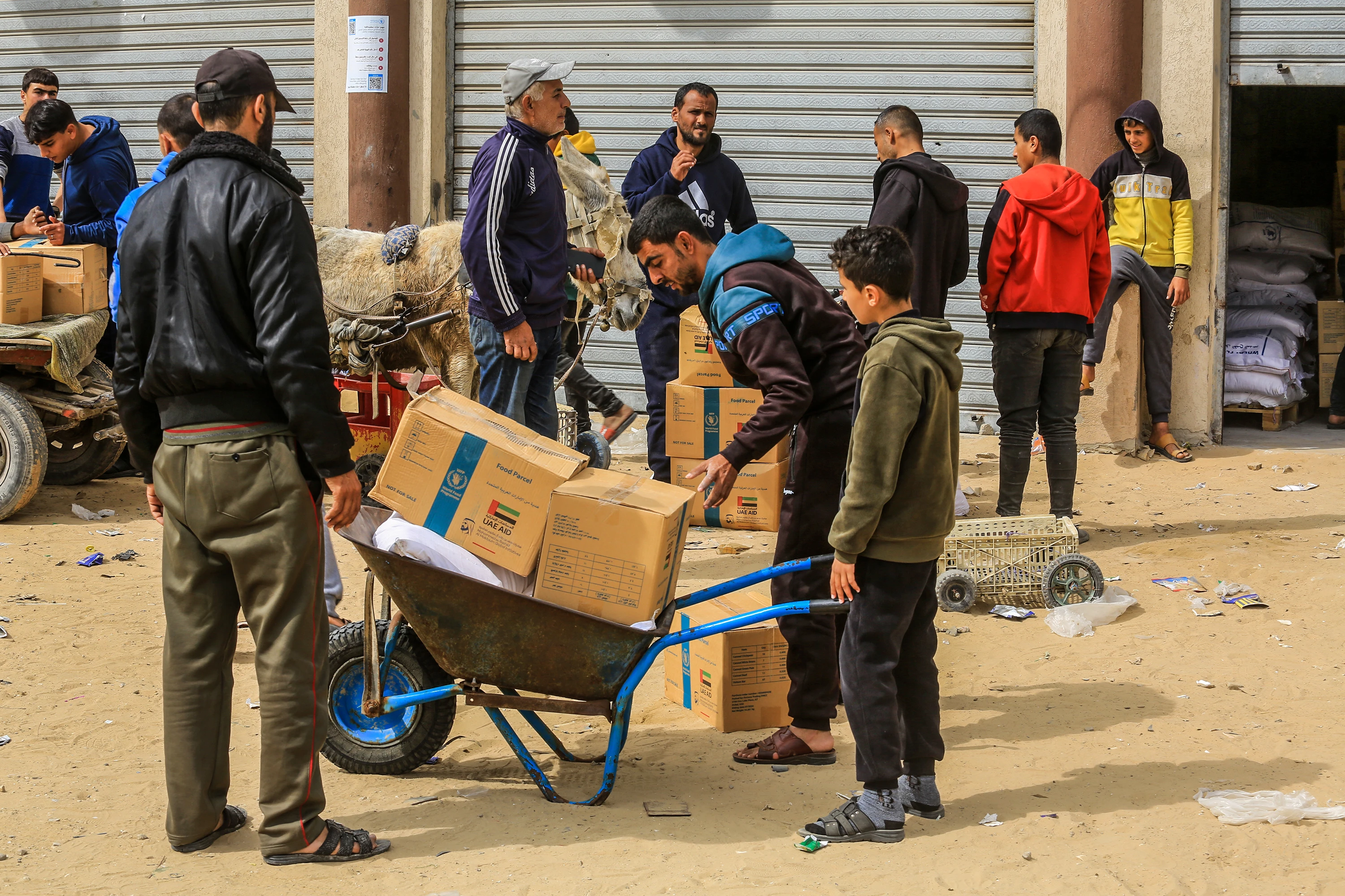 Palestinians receive food aid from the World Food Program (WFP) in cooperation with the United Nations Relief and Works Agency (UNRWA) in Khan Yunis, in the southern Gaza Strip, February 19, 2025. Photo by Abed Rahim Khatib/Flash90