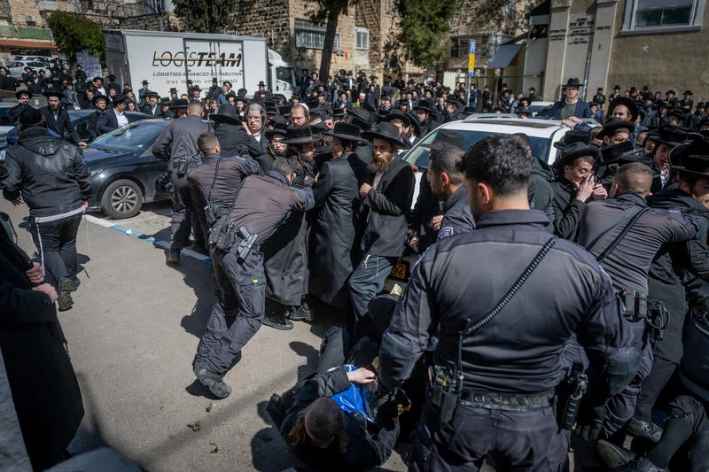 Ultra orthodox Jews protest against the drafting of ultra orthodox jews outside an IDF Recruitment Center in Jeursalem, February 25, 2025. Photo by Chaim Goldberg/Flash90