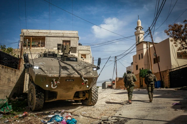 Israeli soldiers operate with their armored vehicles in the West Bank city of Jenin, March 4, 2025. Photo by Nasser Ishtayeh/Flash90