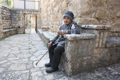 Margalit Zinati, the last member of the Jewish Zinati family seen outside the old synagogue in Peki'in, in the Upper Galilee, March 6, 2025. Photo by David Cohen/Flash90