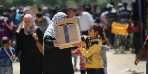 Palestinians receive food aid from the World Food Programme (WFP) at the Nuseirat Refugee Camp, in the central Gaza Strip, April 26, 2025. Photo by Ali Hassan/Flash90