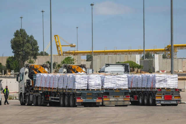 Trucks with loaded with humanitarian aid seen before entering the Gaza Strip, on the Israeli side of the border with the Gaza Strip, May 19, 2025. Photo by Flash90