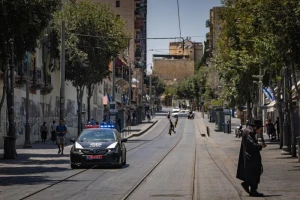 People walk in central Jerusalem near shops that were closed due to the security situation following the missile attacks from Iran, on June 18, 2025. Photo by Yonatan Sindel/Flash90