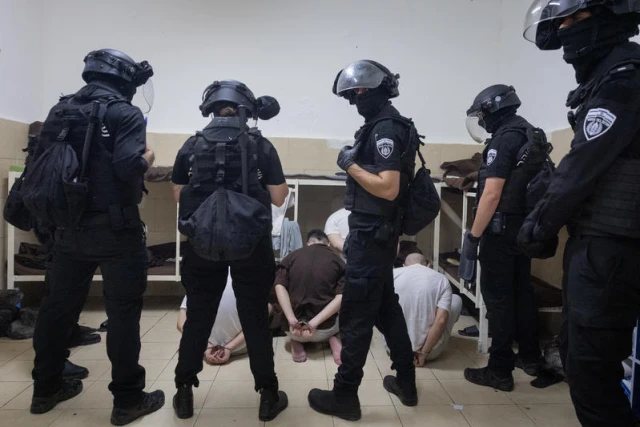 Israeli prison service guards operate in a special wing of Israeli citizens accused of spying for Iran, in the Damon Prison, in the Druze town of Daliyat al-Karmel, northern Israel, July 1, 2025. Photo by Chaim Goldberg/Flash90