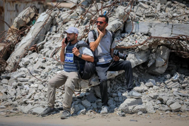 Palestinian journalists in the central Gaza Strip, July 26, 2025. (Photo by Ali Hassan/Flash90)