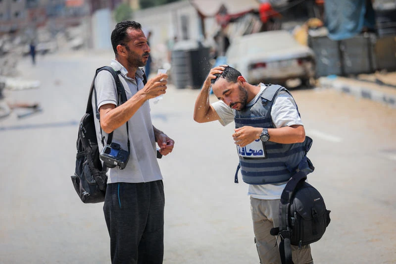 Palestinian journalists report on the war and ongoing humanitarian crisis in the central Gaza Strip, July 26, 2025. Photo by Ali Hassan/Flash90
