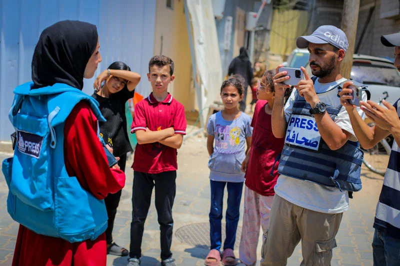 Palestinian journalists report on the war and ongoing humanitarian crisis in the central Gaza Strip, July 26, 2025. Photo by Ali Hassan/Flash90