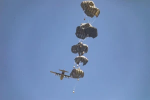 A plane drops humanitarian aid loaded with food supplies to displaced Palestinians in the northern Gaza Strip, July 27, 2025. Photo by Ali Hassan/Flash90