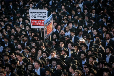 Ultra Orthodox Jewish men block a road during a protest against the jailing of Jewish seminary students who failed to comply with an army recruitment order in Jerusalem on August 07, 2025. Photo by Yonatan Sindel/Flash90