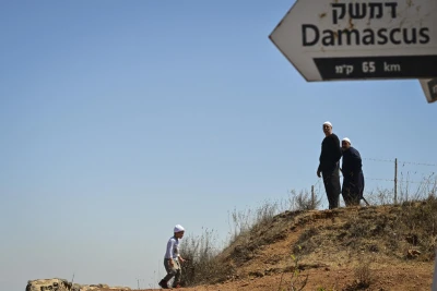 People look at the view on Mount Bental, overlooking the border with Syria, in the Golan Heights on August 30, 2025. Photo by Michael Giladi/Flash90