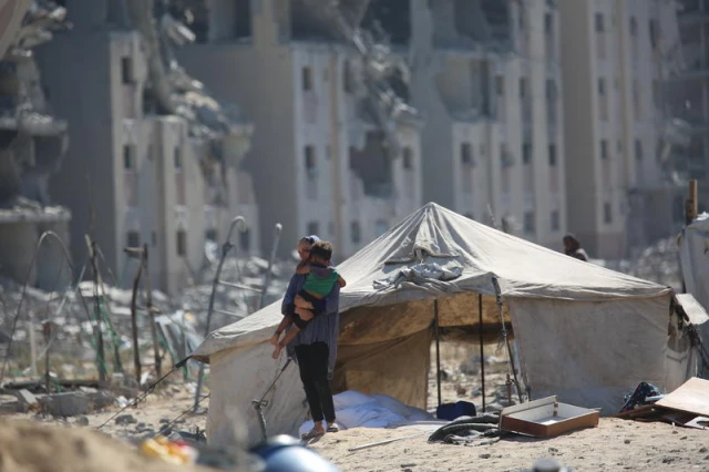 Displaced Palestinians seen near their tents at the Nuseirat camp in the central Gaza Strip, September 13, 2025. Photo by Ali Hassan/Flash90