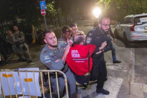 Police remove relatives of hostages and their supporters demonstrating outside Prime Minister Benjamin Netanyahu's residence in Jerusalem, September 16, 2025. (Chaim Goldberg/Flash90)