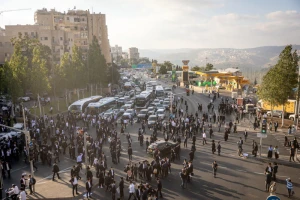 Ultra Orthodox Jewish men block a road during a protest against the jailing of Jewish seminary students who failed to comply with an army recruitment order in Jerusalem on September 18, 2025. Photo by Chaim Goldberg/Flash90