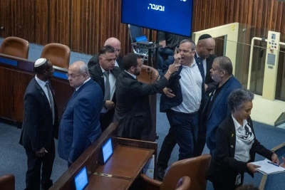 MK Gilad Kariv is taken out during a plenary session of the opening day of the winter session at the Knesset, the Israeli parliament in Jerusalem, on october 20, 2025. Photo by Chaim Goldberg/Flash90