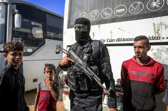 Masked members of the Palestinian Hamas movement arrest several members of Yasser Abu Shabab, who are accused of collaborating with the Israeli army in the Gaza Strip, according to Hamas members, in the southern Gaza Strip. Photo by Saeed Mohammed/Flash90.