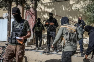 Masked members of the Palestinian Hamas movement arrest several members of Yasser Abu Shabab, who are accused of collaborating with the Israeli army in the Gaza Strip, according to Hamas members, in the southern Gaza Strip. Photo by Saeed Mohammed/Flash90.