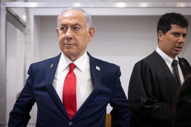 Israeli Prime Minister Benjamin Netanyahu arrives to the courtroom at the Distrcit court in Tel Aviv, before the start of his testimony in the trial against him, October 28, 2025. Photo by Miriam Alster/Flash90