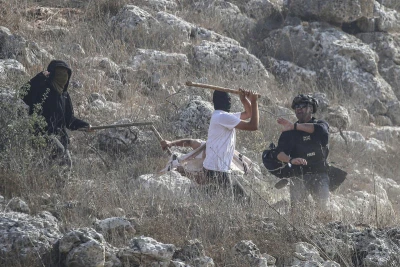 Jewish settlers attack journalists during the olive-picking season in the village of Beita, south of Nablus in the West Bank, November 8, 2025. Photo by Nasser Ishtayeh/Flash90