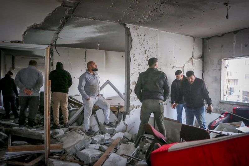 Palestinians inspect a destroyed apartment demolished by the Israeli army in an Israeli military operation targeting a Palestinian terrorist in the city of Nablus, November 25, 2025. (Photo: Nasser Ishtayeh/Flash90)