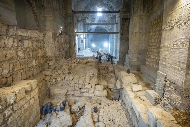 Workers at an excavation in the Kishle at the Tower of David Museum in Jerusalem’s Old City, where an impressive section of the city’s Hasmonean wall was uncovered during an Israel Antiquities Authority excavation, December 8, 2025. Photo by Yonatan Sindel/Flash90