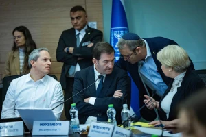 MK Gilad Kariv speaks with MK Boaz Bismuth and Knesset Foreign Affairs and Defense Committee legal adviser Miri Frenkel Shor during a Foreign Affairs and Defense Committee meeting at the Knesset, the Israeli Parliament in Jerusalem, December 9, 2025. Photo by Yonatan Sindel/Flash90