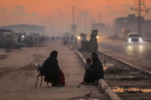 Displaced Palestinians are seen on a street in Nuseirat camp, in the central Gaza Strip, on December 17, 2025. Photo by Ali Hassan/Flash90