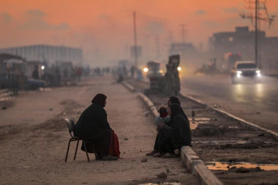 Displaced Palestinians are seen on a street in Nuseirat camp, in the central Gaza Strip, on December 17, 2025. Photo by Ali Hassan/Flash90