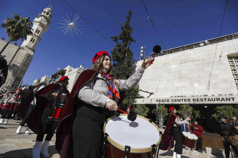 People attend the annual Christmas eve procession in the Church of the Nativity, in Bethlehem, December 24, 2025. Photo by Wisam Hashlamoun/Flash90