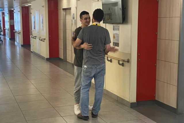 Sagui Dekel-Chen, freed after 498 days in captivity, visits fellow Israeli-American hostage survivor Edan Alexander in hospital. (Photo: Bring Them Home / X)