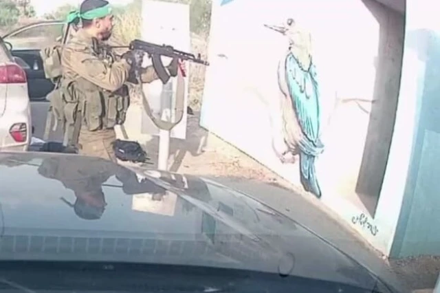 A Hamas terrorist fires into the "death shelter" where dozens of partygoers were hiding on October 7, 2023.
Photo: Wikimedia Commons.