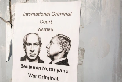 Washington, D.C. US - December 27, 2024: a poster accusing Benjamin Netanyahu to be a war criminal wanted by International Criminal Court with his mugshot in the center. Photo: Shutterstock.