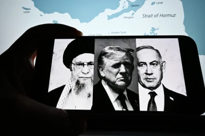 Photos of Trump, Netanyahu, and Khamenei are visible on the screen. Photo: Miss.cabul/Shutterstock.